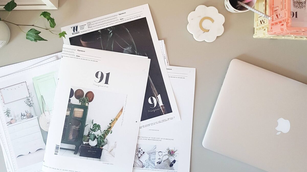 Magazine Publishing with a laptop on a desk