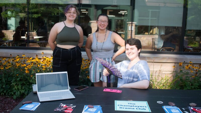 Drama club posing with a fan outside of IDX