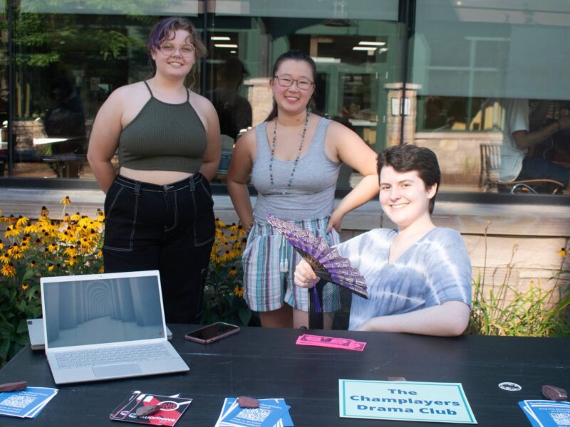Drama club posing with a fan outside of IDX