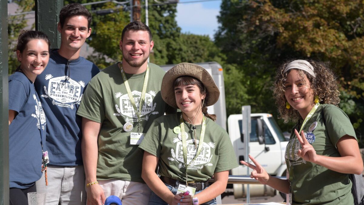 Resident Advisors outside wearing green and grey shirts