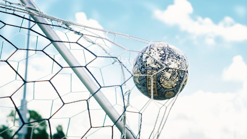 Soccer ball hitting goal net