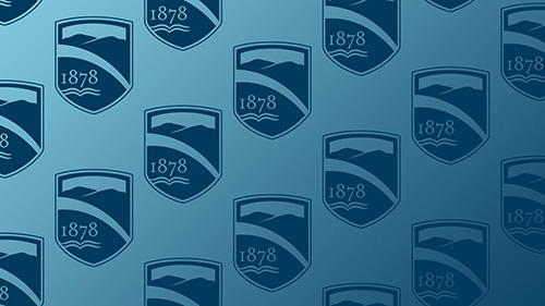Champlain College shield logo on blue
