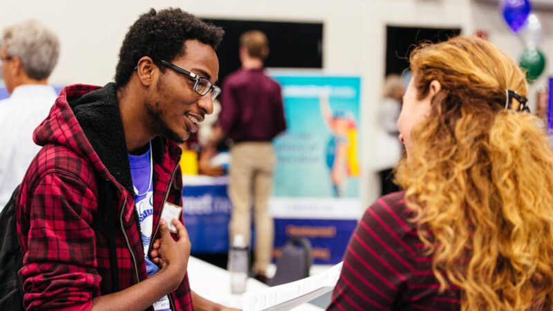 Student meeting with person at career fair