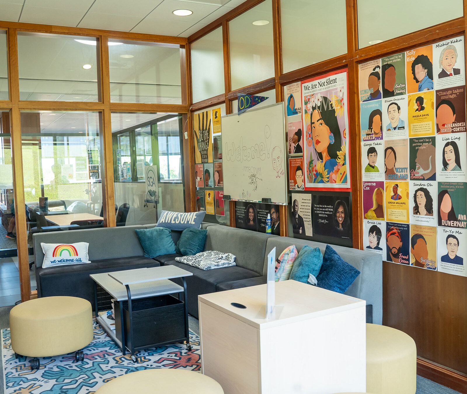 wide view of the office of diversity and inclusion, with comfy chairs and couches and posters of powerful diversity figures throughout history