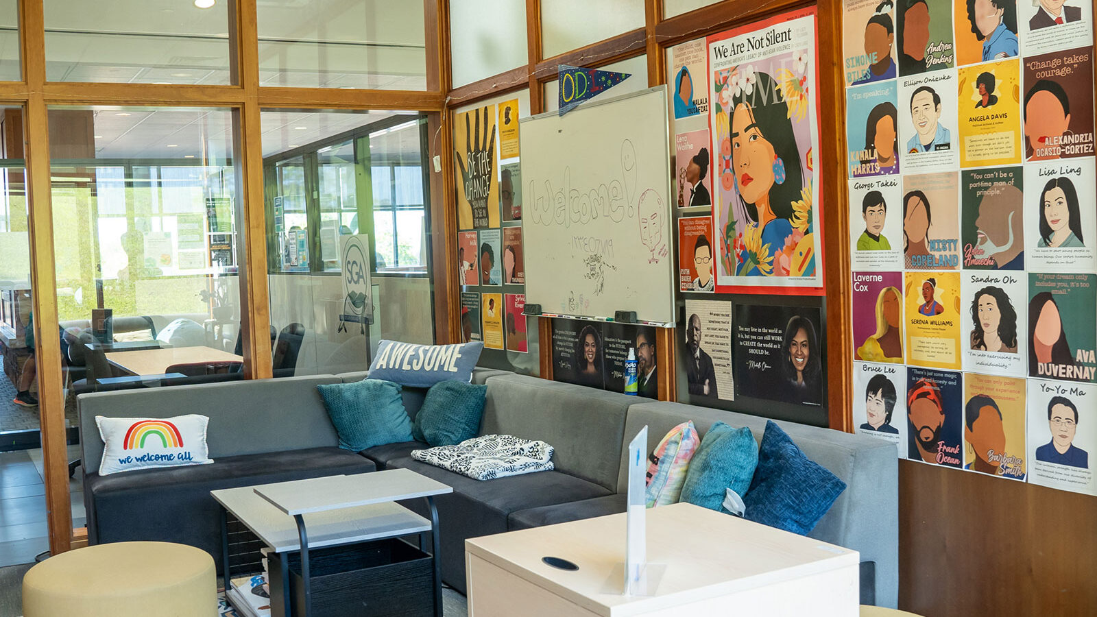 wide view of the office of diversity and inclusion, with comfy chairs and couches and posters of powerful diversity figures throughout history