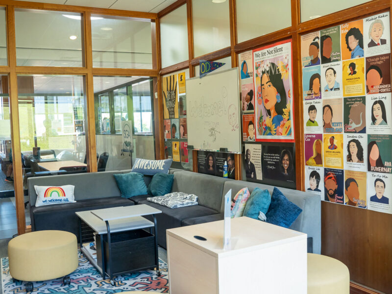 wide view of the office of diversity and inclusion, with comfy chairs and couches and posters of powerful diversity figures throughout history