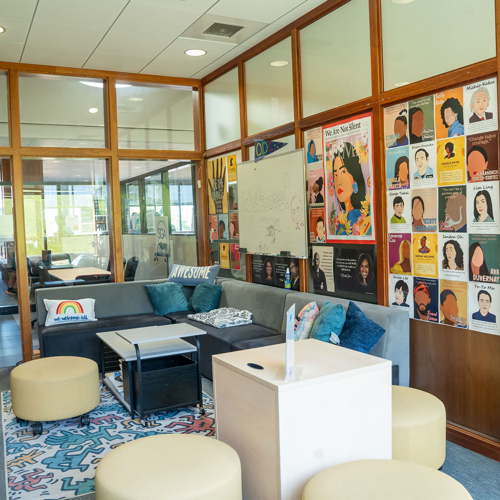 wide view of the office of diversity and inclusion, with comfy chairs and couches and posters of powerful diversity figures throughout history
