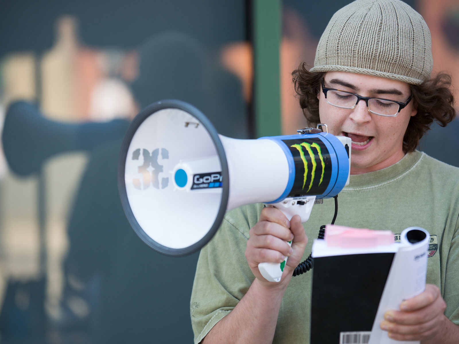 students uses a bullhorn; reads from notes