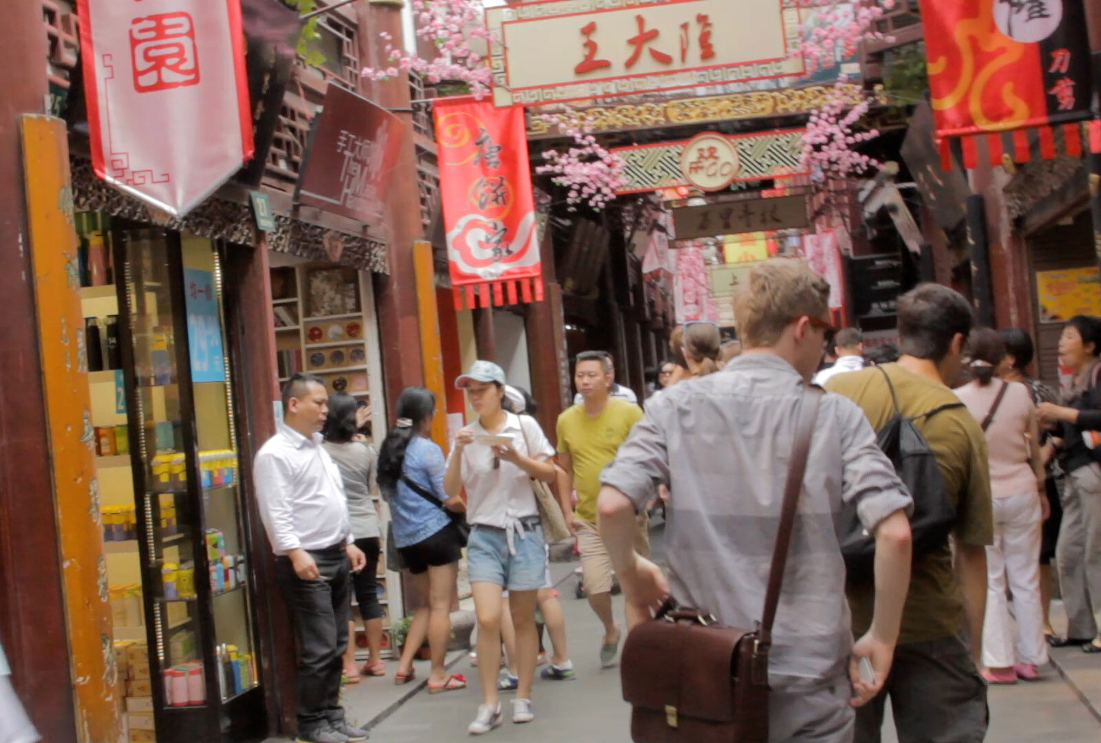 busy Asian alley filled with pedestrian traffic