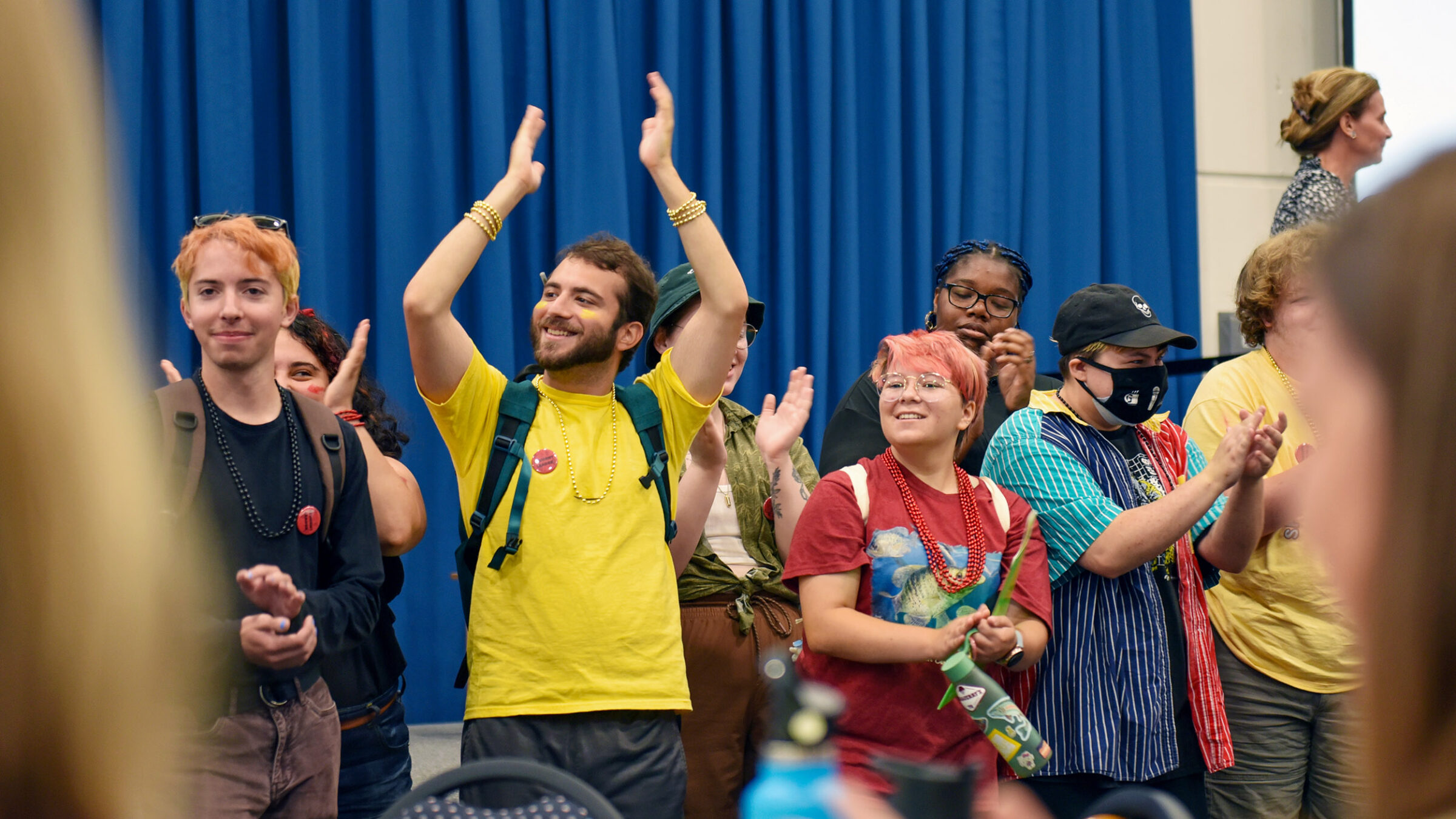 groups of students applauding, clapping