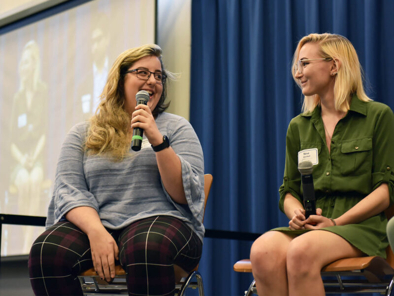 Students chat on stage at Sophomore Summit