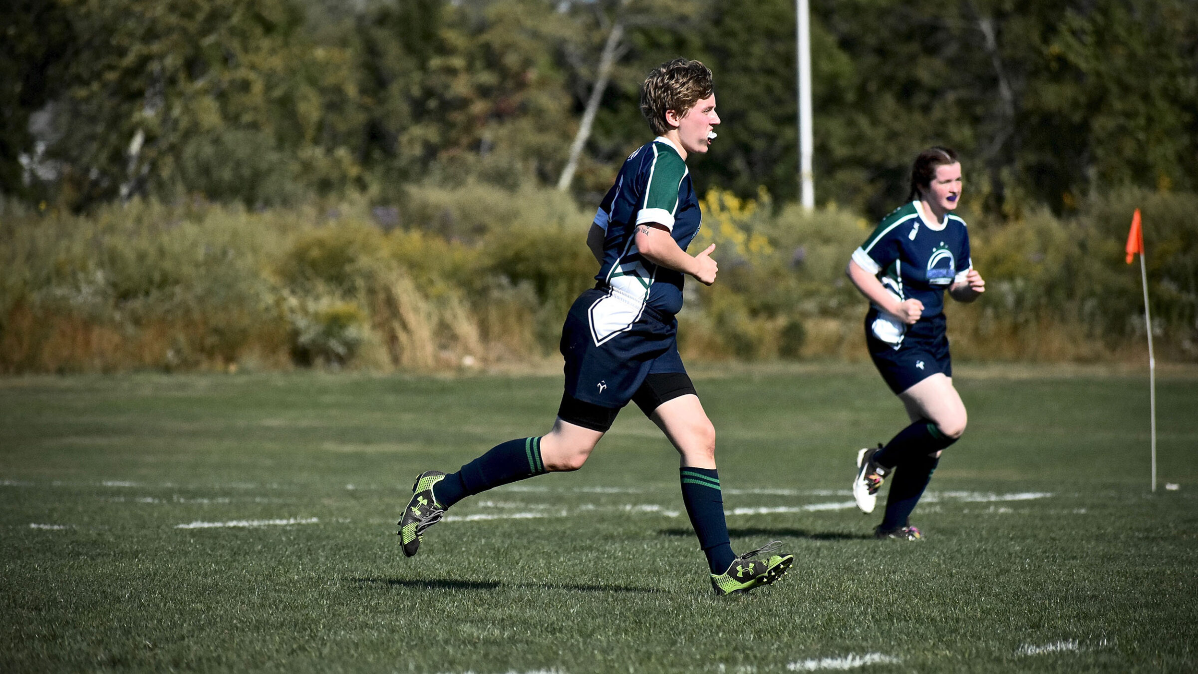 Maddy Wailonis on a rugby field playing in a match