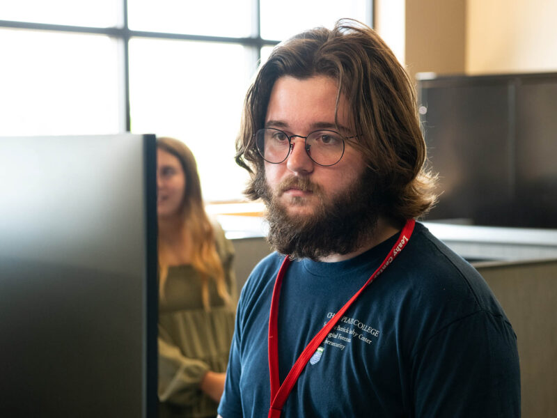 a student looks at a computer screen