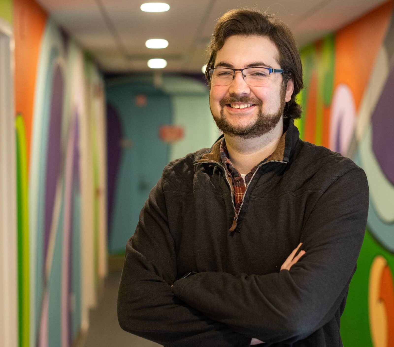 Reid Anctil standing in the hallway