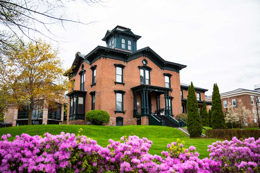 a photo of a victorian mansion on campus