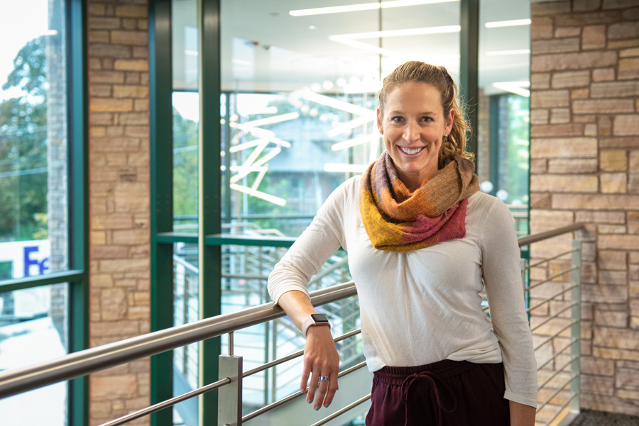 Dr, Kylie King leaning against the railing in CCM