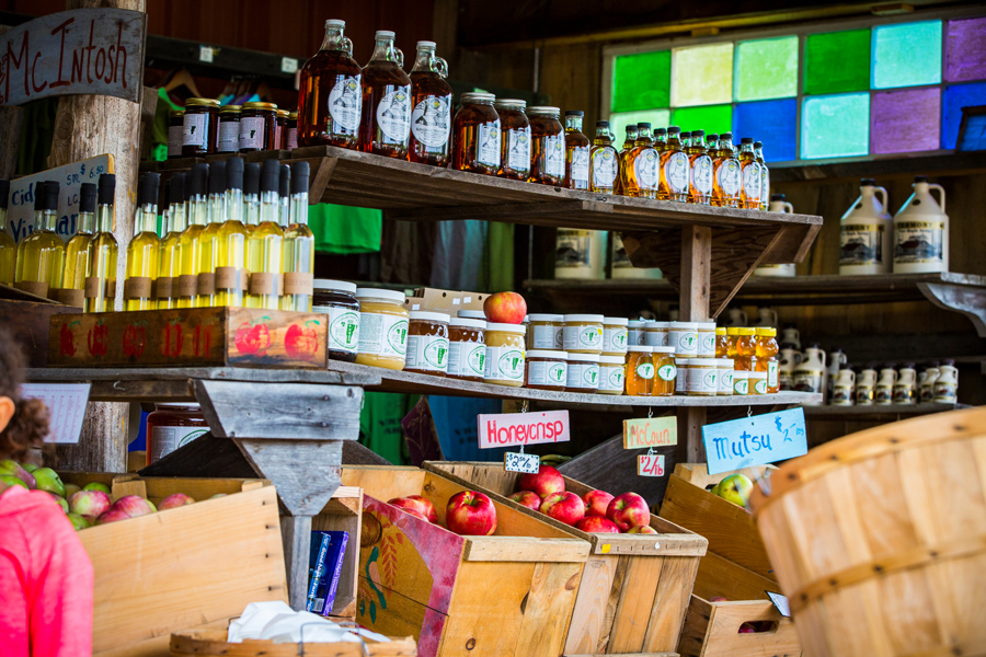 a shop from Shelburne Orchards including a variety of apples, maple syrup, oils, and honey 