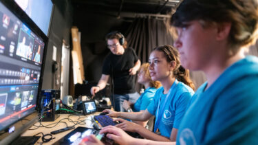 High school students edit video footage at a Champlain College Pre-College Summer program.