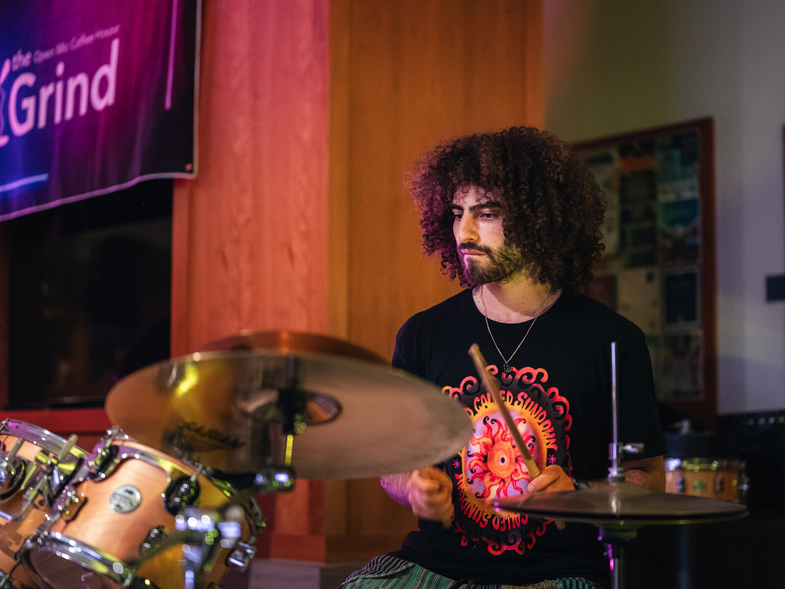 this grind performance features a student playing drums with his band