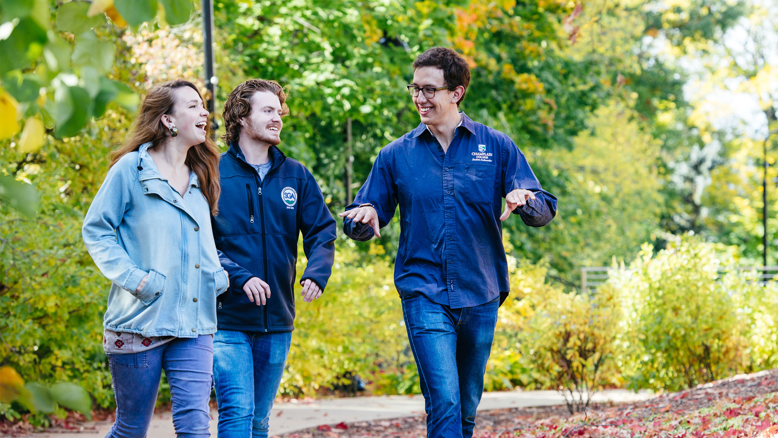 Students walking on a campus tour with a student ambassador in the summer