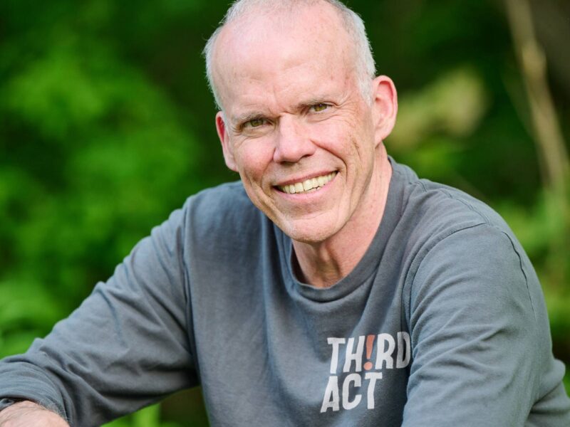 Bill McKibben sitting in front of vibrant nature