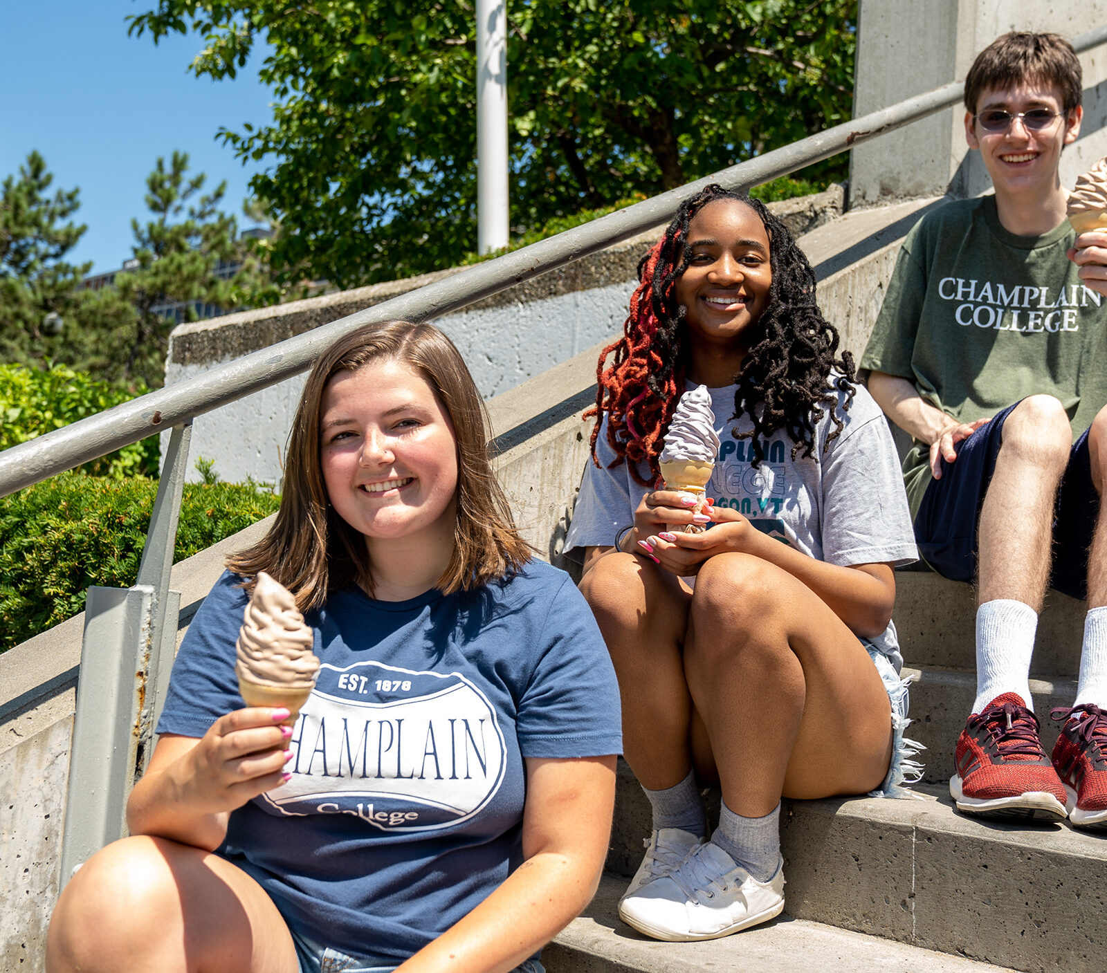 Students having creemees on steps outside