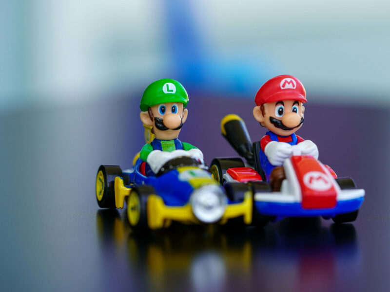 figures of Mario and Luigi in racing Karts on a table