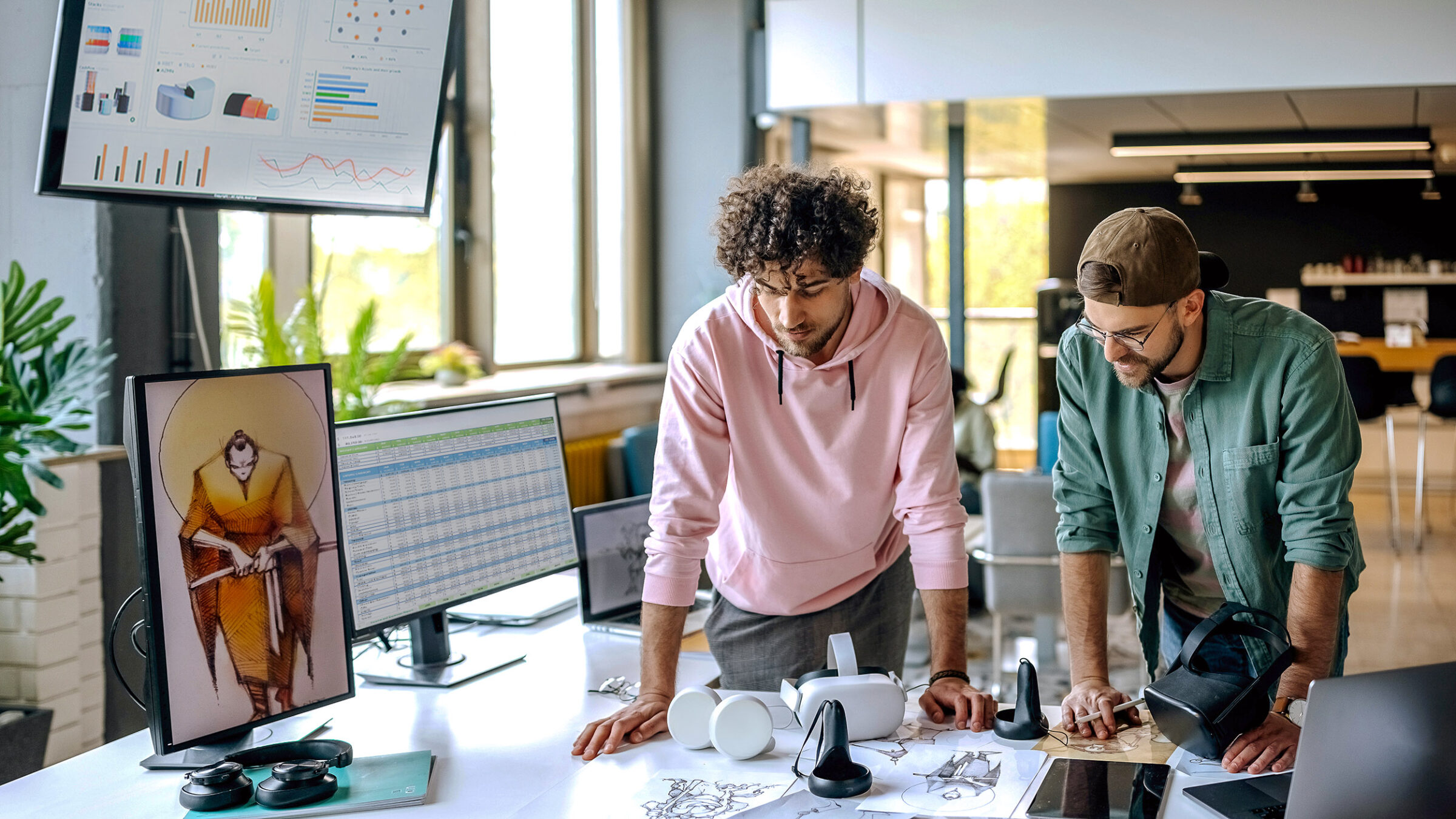 Two young gaming professionals at work