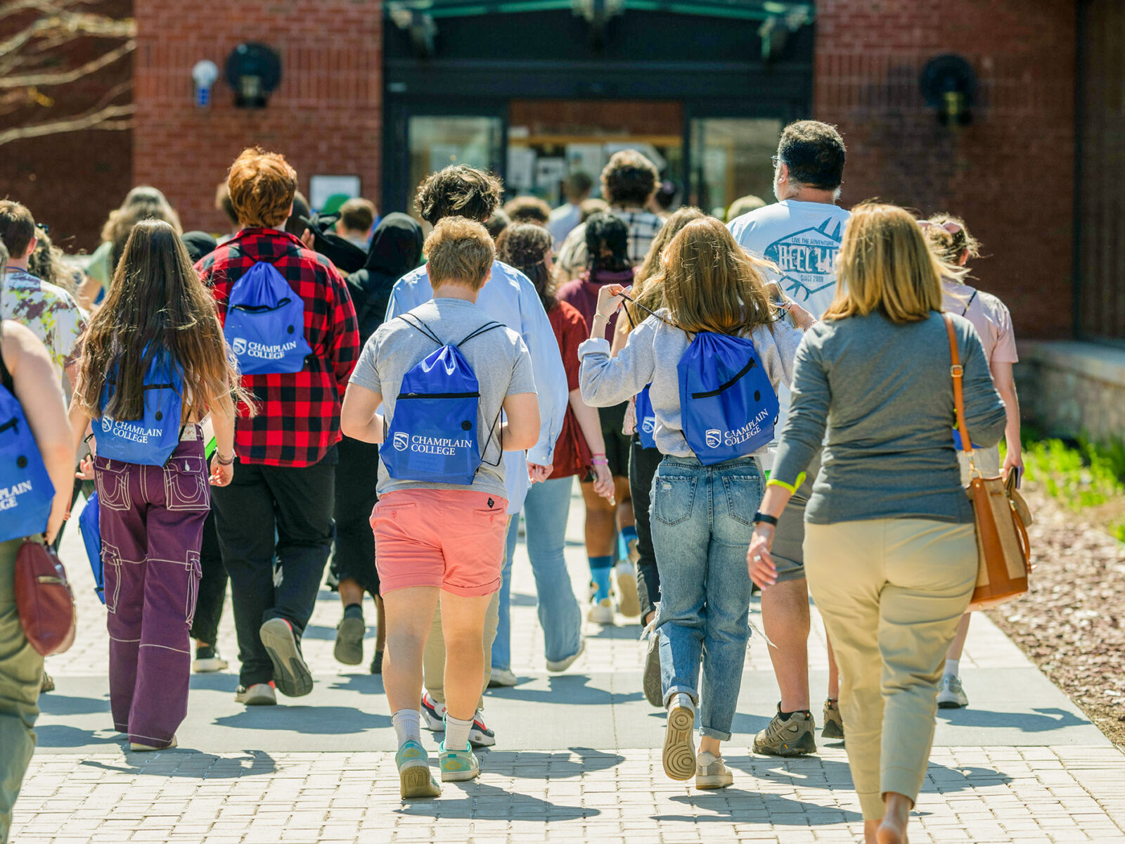 tour groups walks away from camera