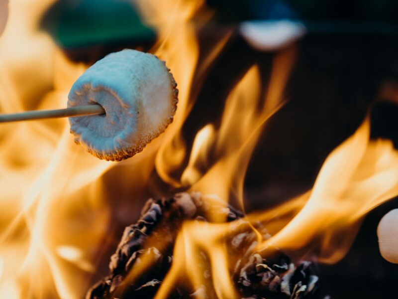a marshmallow being roasted over a fire