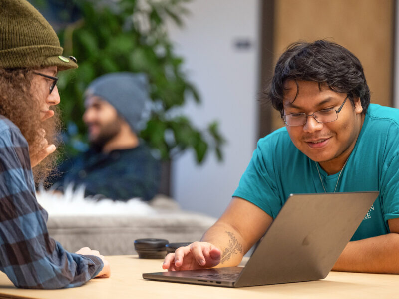 students looking at a laptop