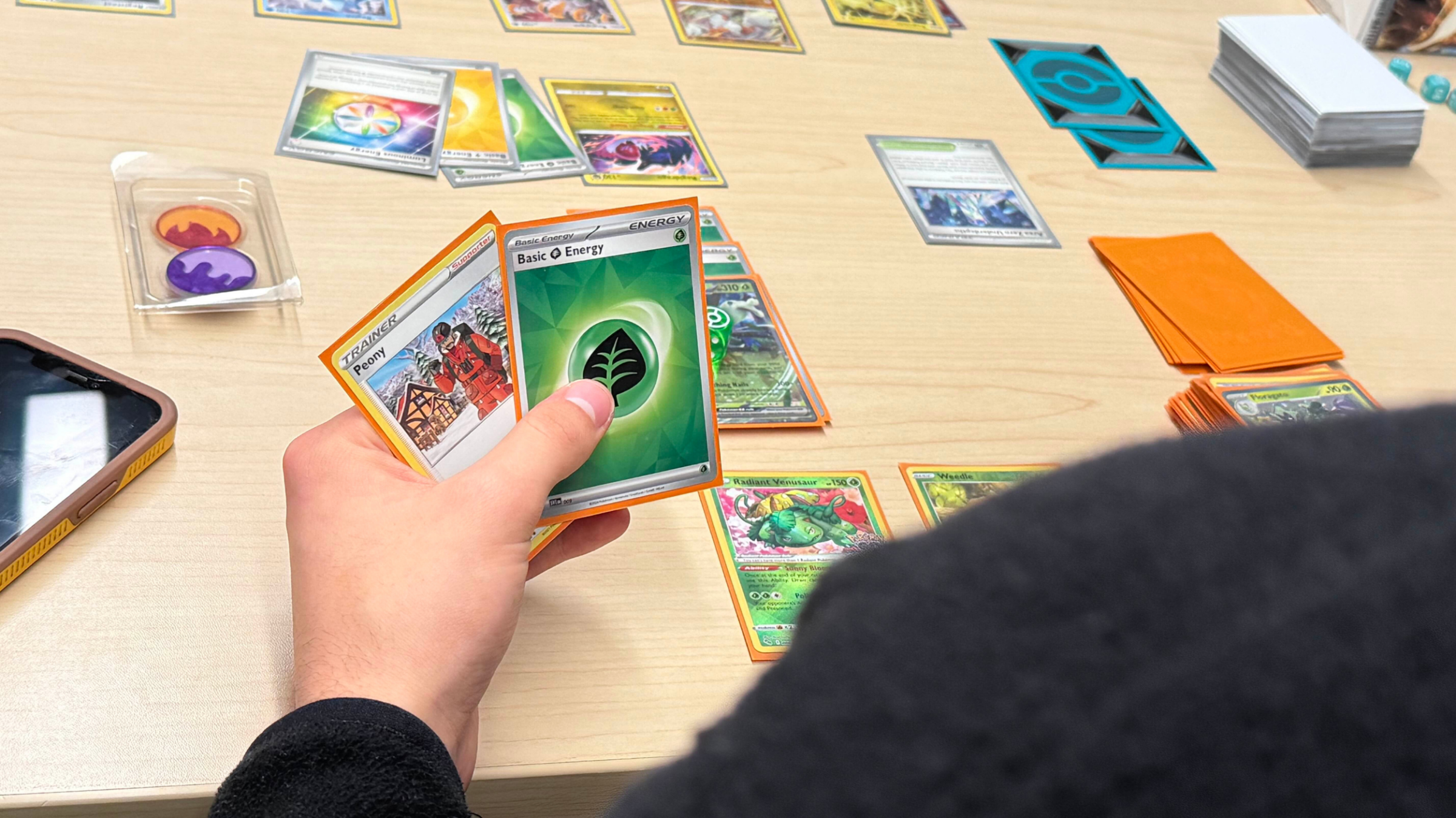 cards on a table, players hold cards