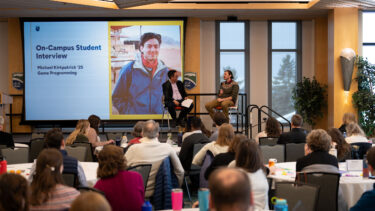 michael kirkpatrick and president hernandez sit on stage for a conversation