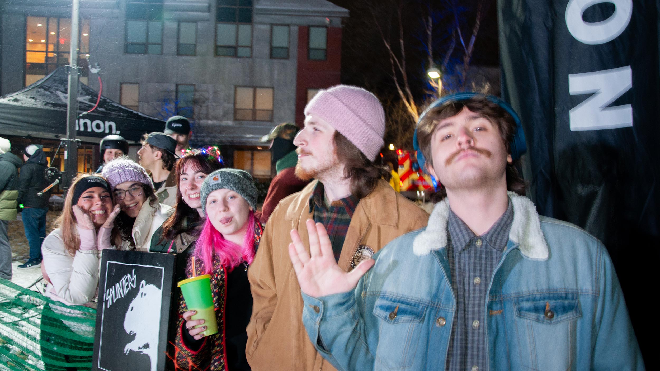 Students making funny faces at the camera and having fun at the Burton Winter Jam at Champlain College