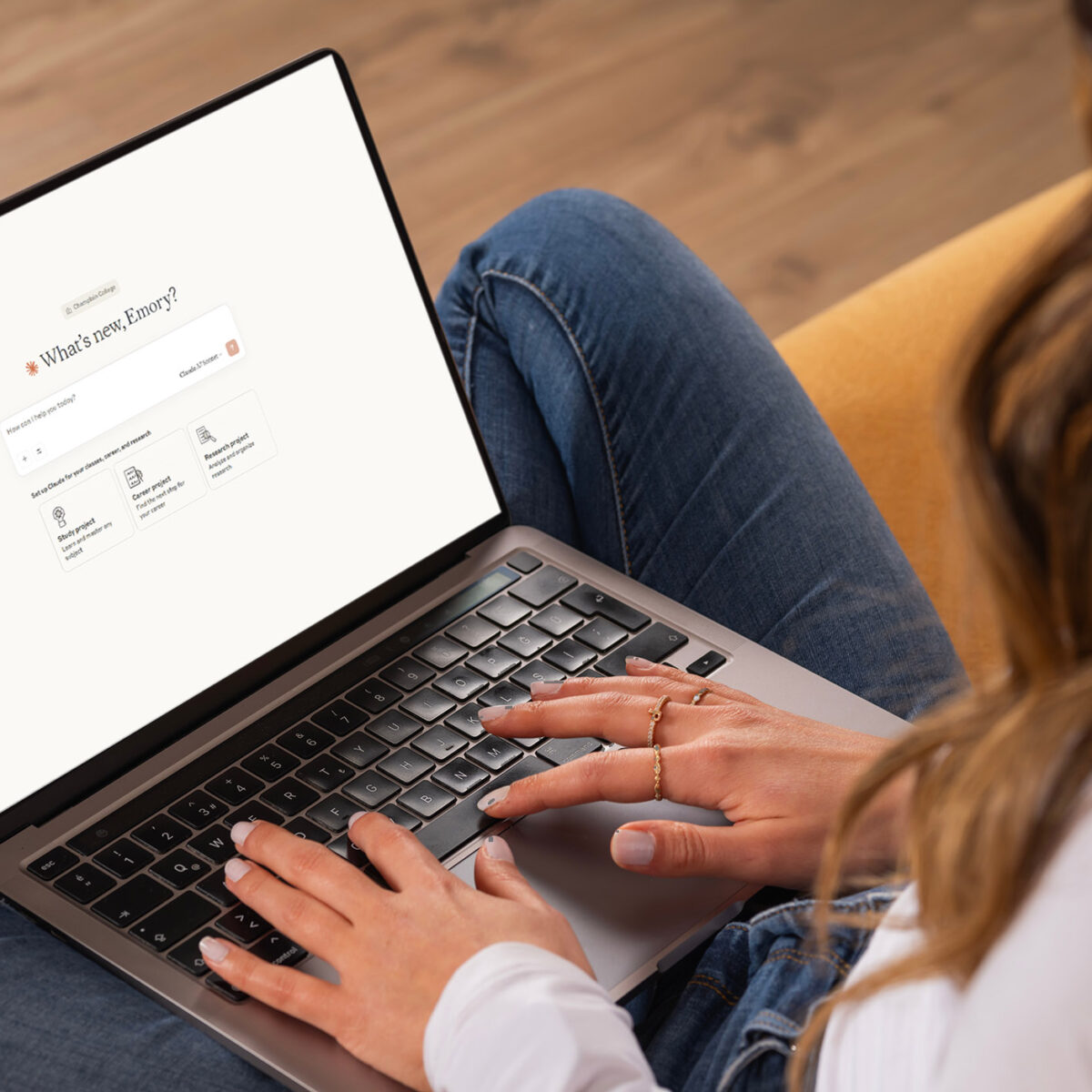 Over shoulder laptop claude welcome screen, young caucasian brunette