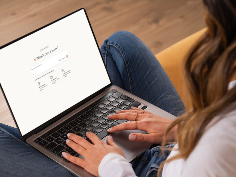 Over shoulder laptop claude welcome screen, young caucasian brunette