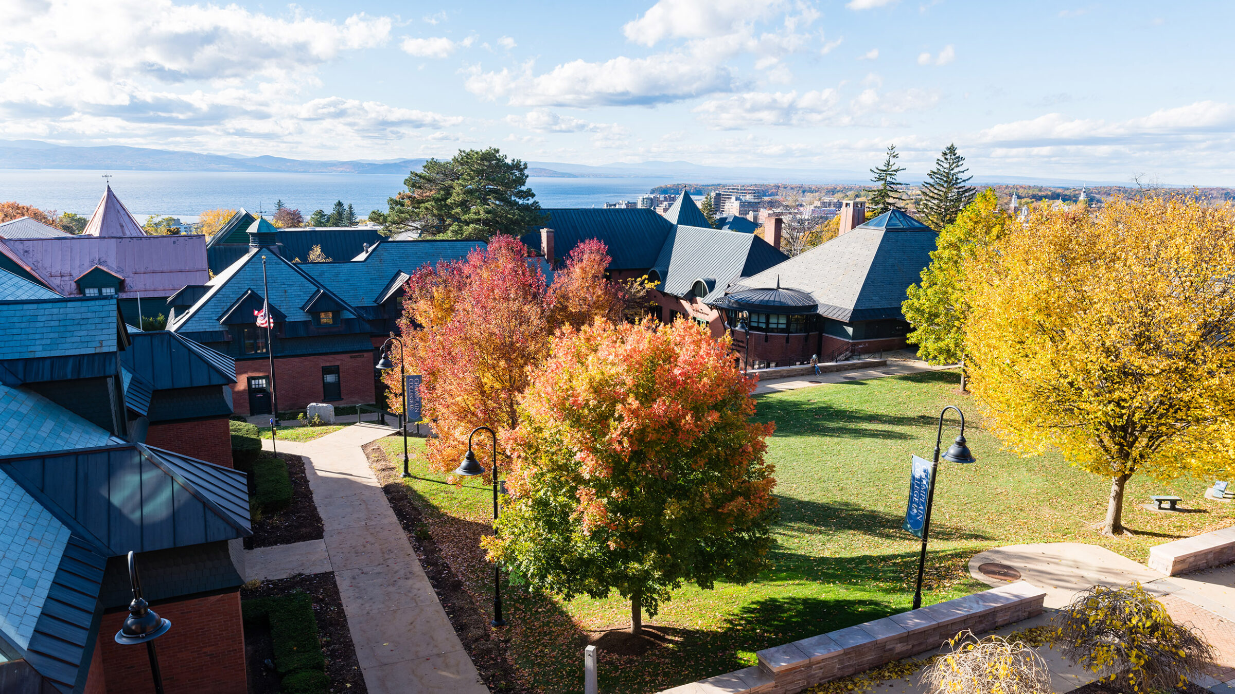 view of the campus looking toward lake and downtown Burlington, VT; autumn leaves on trees
