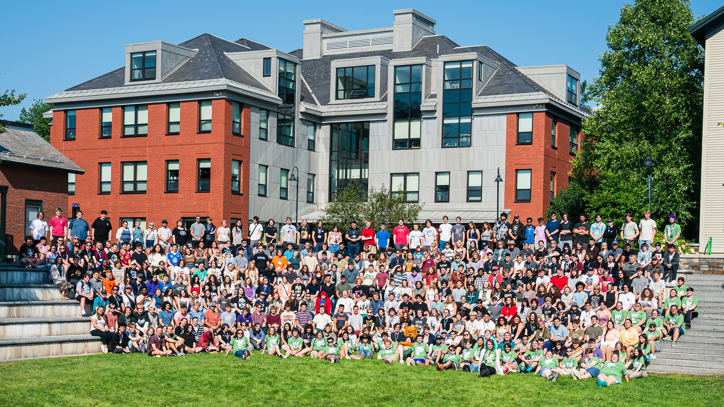members of the class of 2028 and orientation leaders pose for a big class photo on finney quad