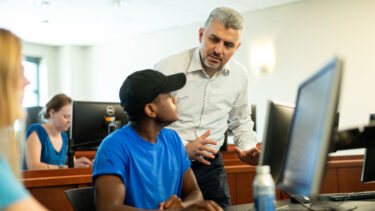 Professor Murat Gungor teaching students in a classroom