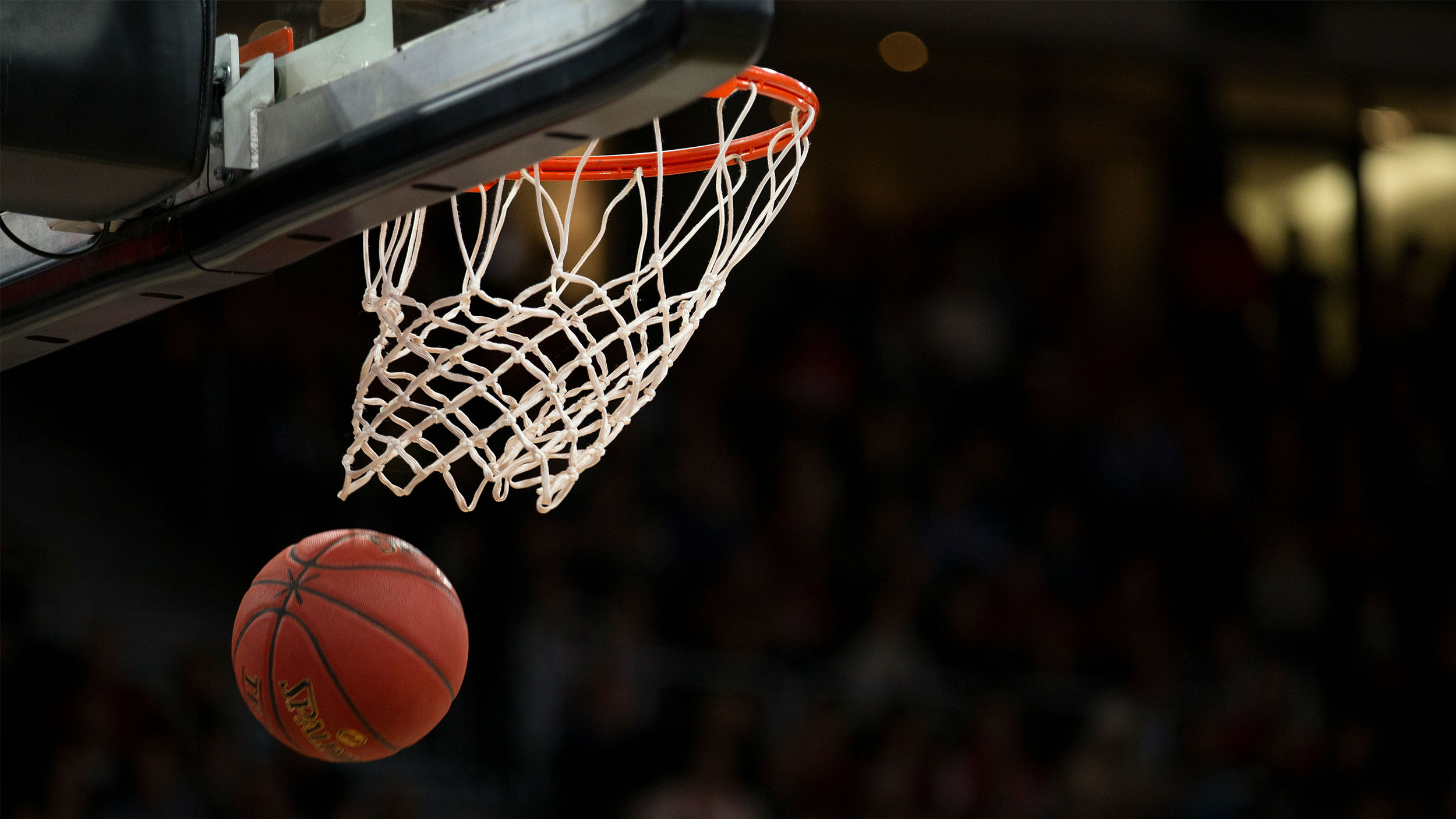 basketball swishes through hoop