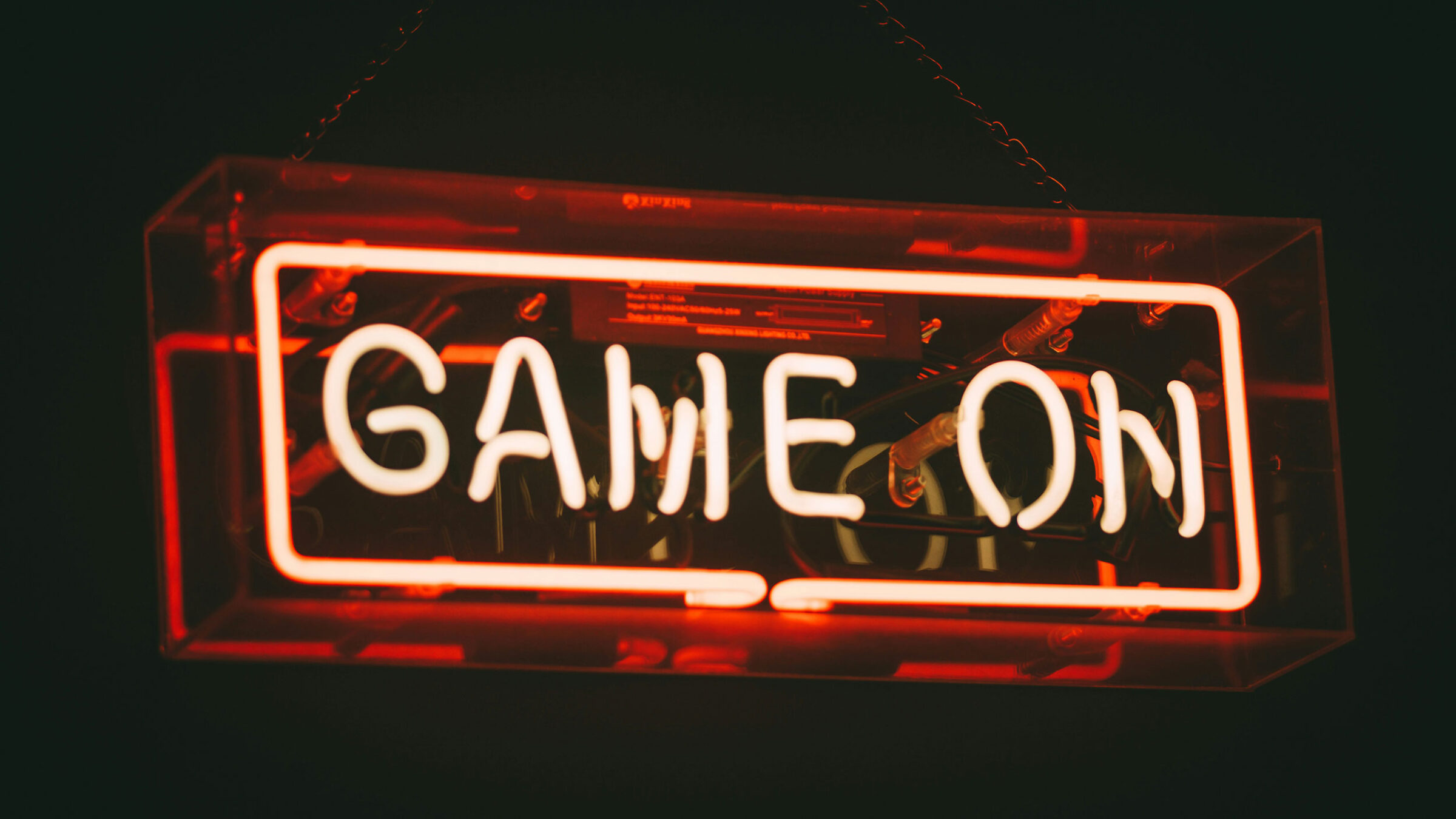 red light up sign that says "game on"