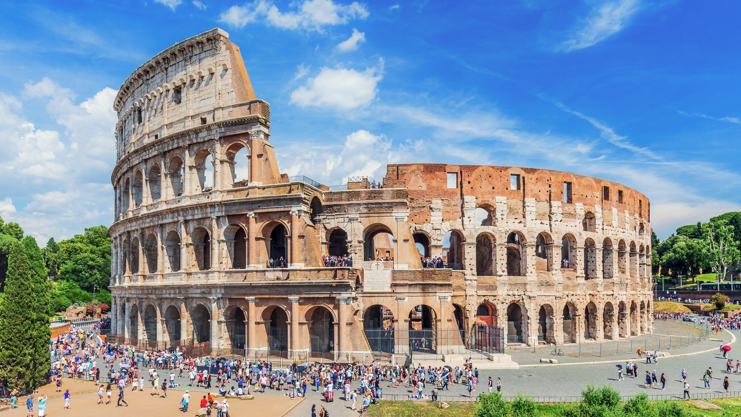 Colosseum in Rome, Italy on a sunny day, tourists
