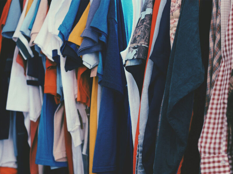 clothing rack of hanging shirts