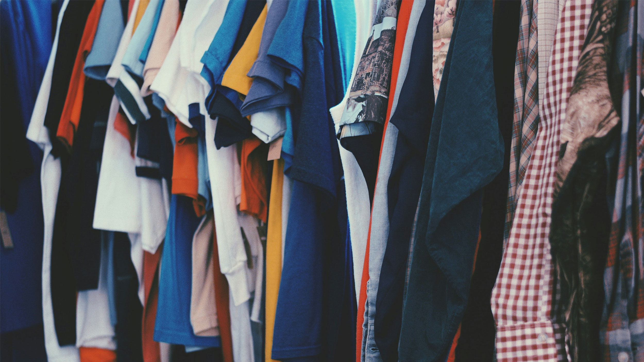 clothing rack of hanging shirts