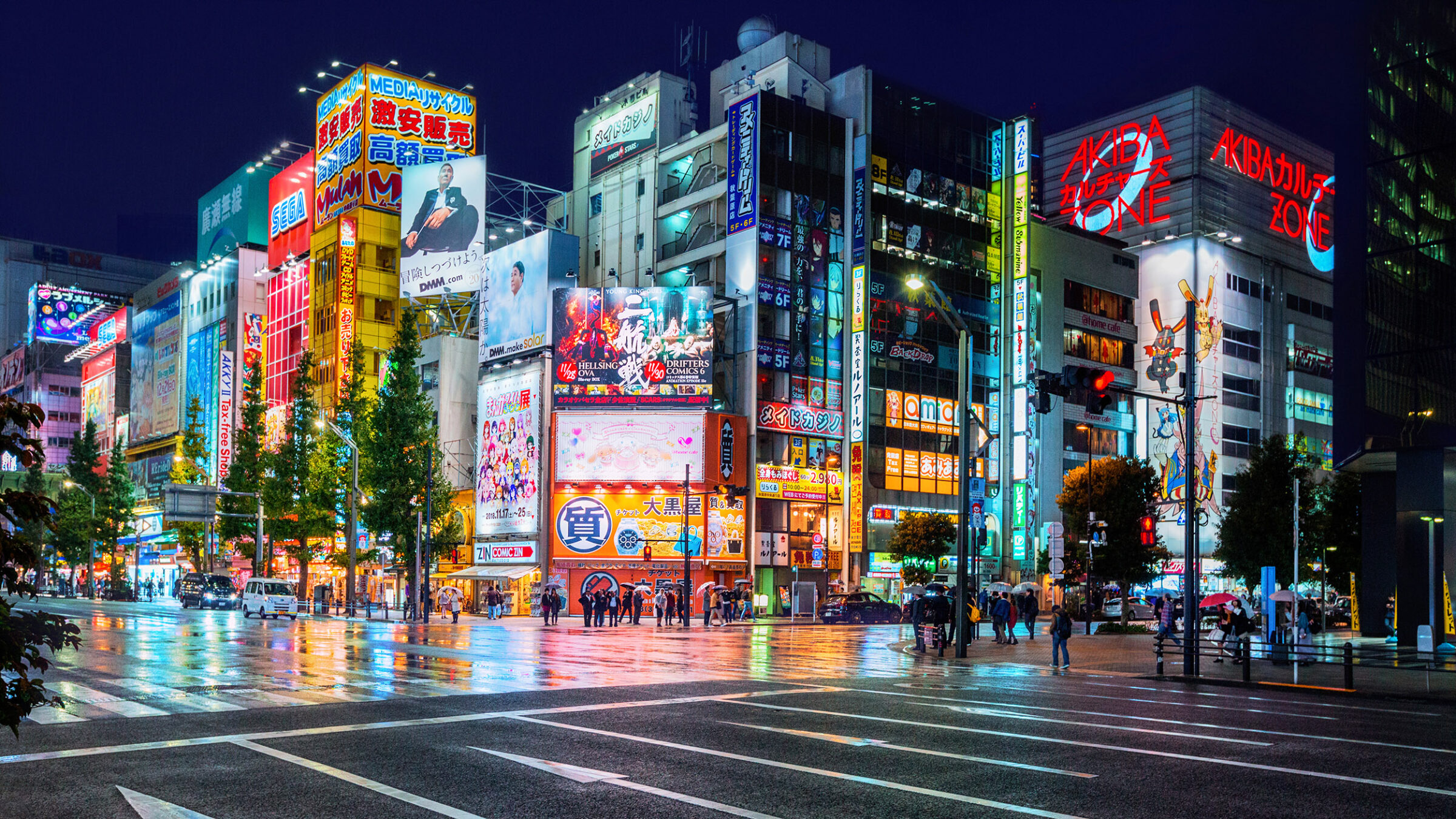 Neon lights and billboard advertisements on buildings at Akihabara at rainy night, Tokyo, Japan