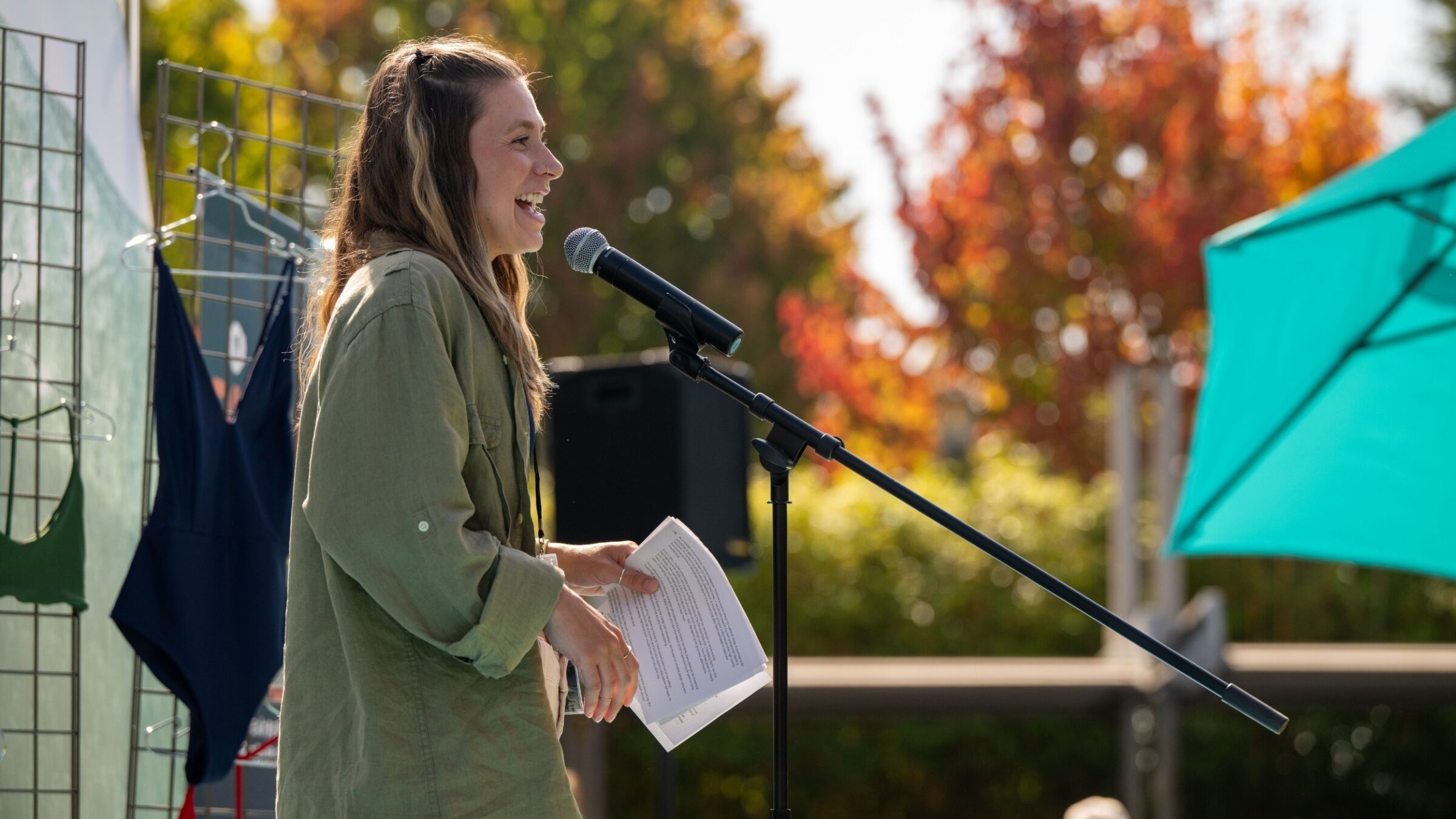 Emily standing in front of her products speaking at Pitch Fest