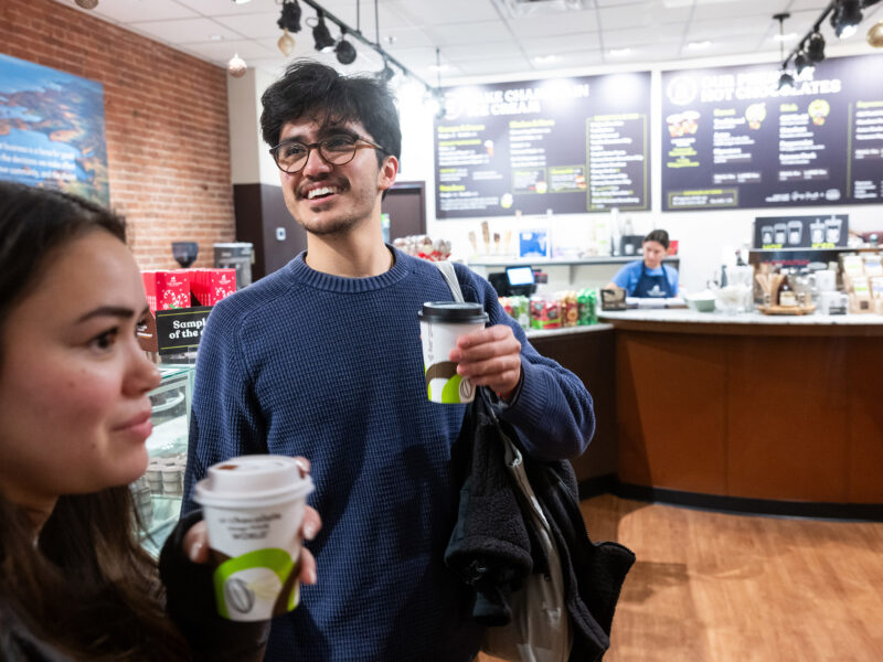 two students order coffee at a shop on Church Street