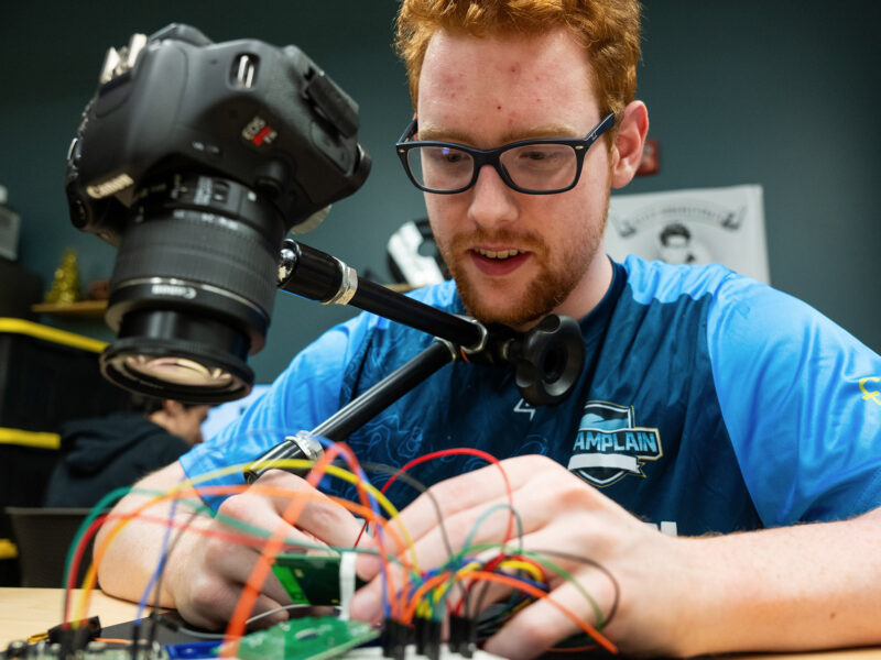 a student works with computer components