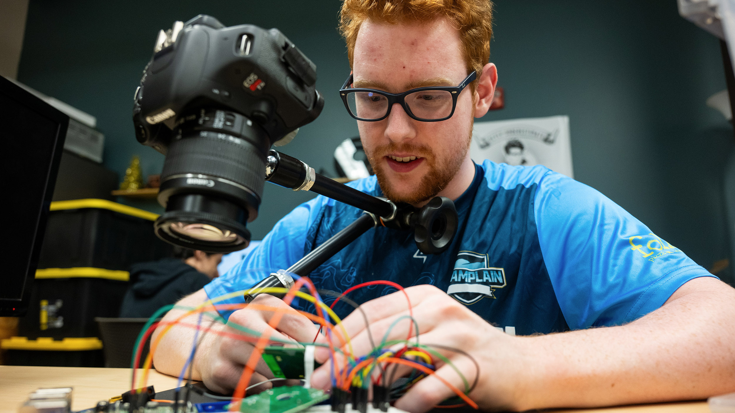 a student works with computer components