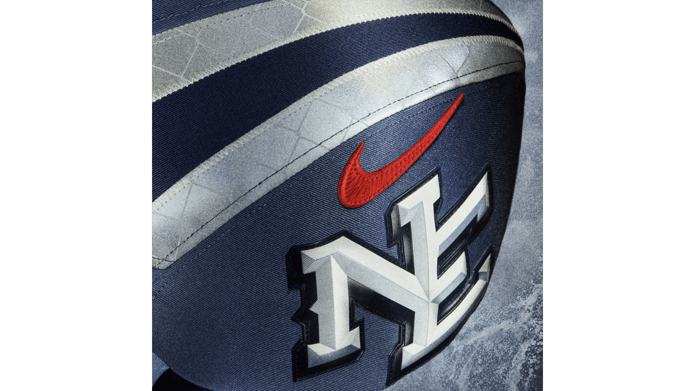 Nike swoosh and New England Patriots logo on a jersey designed by Champlain alum Liam O'Neil